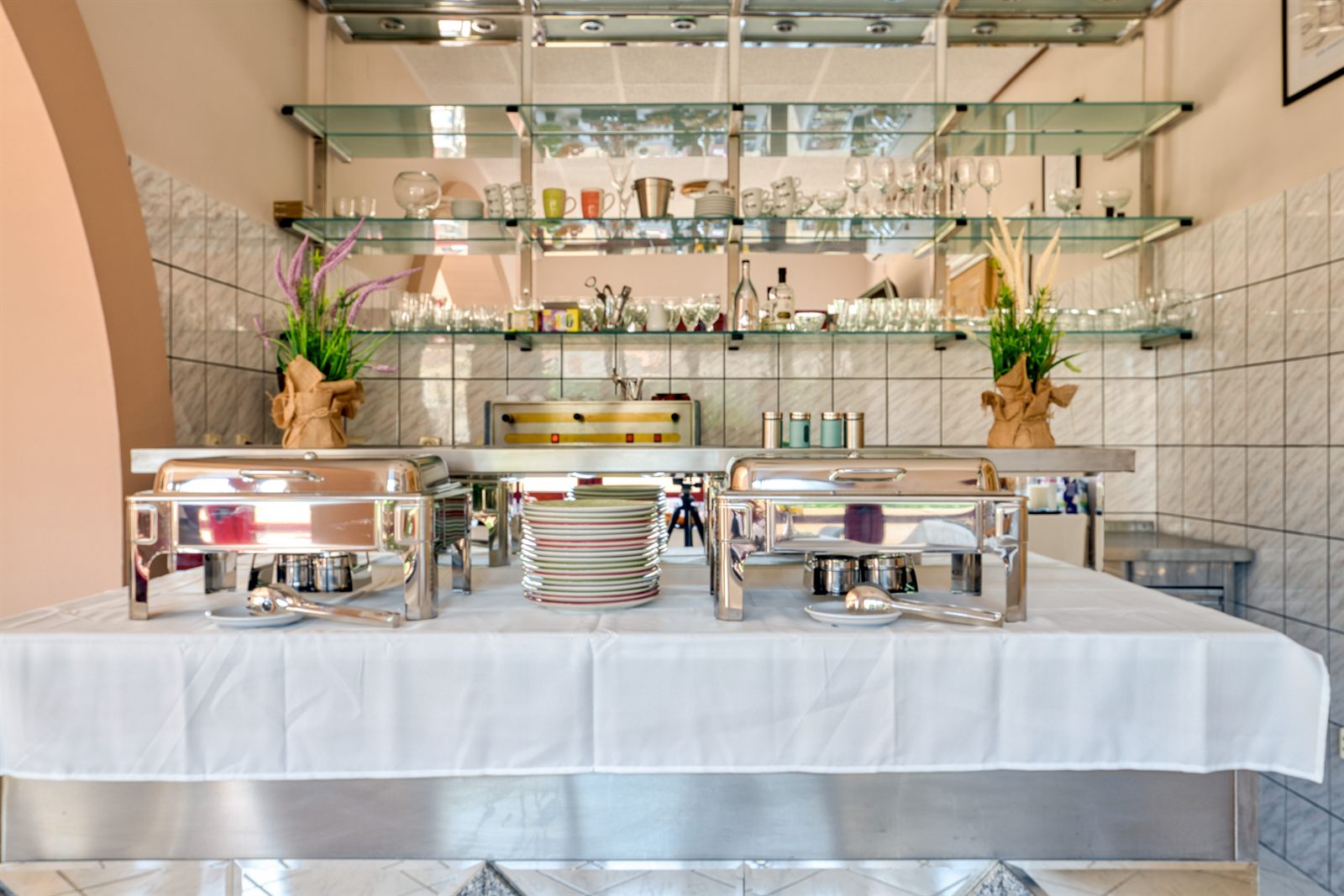 Buffet shelves with glassware and plates